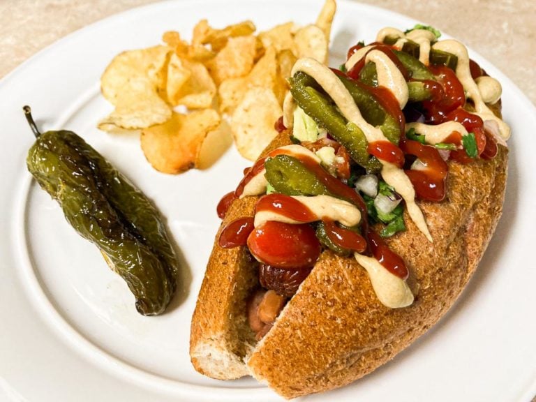 Sonoran hot dog with potato chips and grilled jalapeno pepper