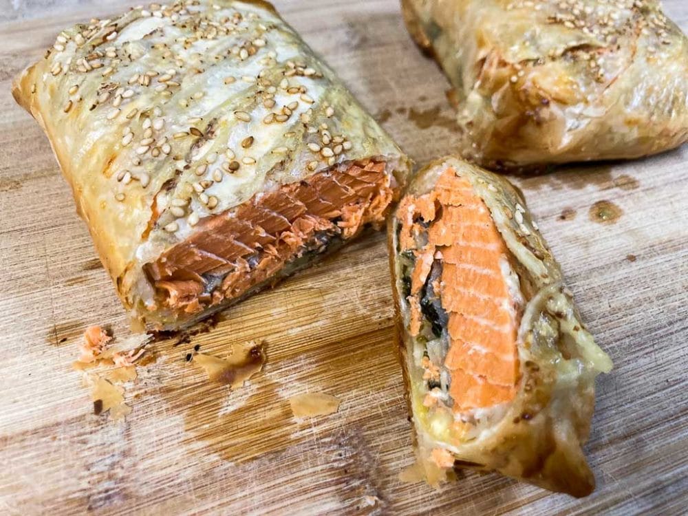 Wild salmon Wellington on cutting board