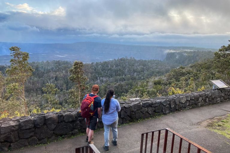 Rim Trail behind Volcano House with hikers, Hawai'i Volcanoes National Park, Hawaii