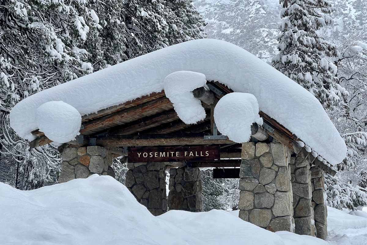 Snow covers the Yosemite Falls bus stop in Yosemite National Park - Image credit NPS