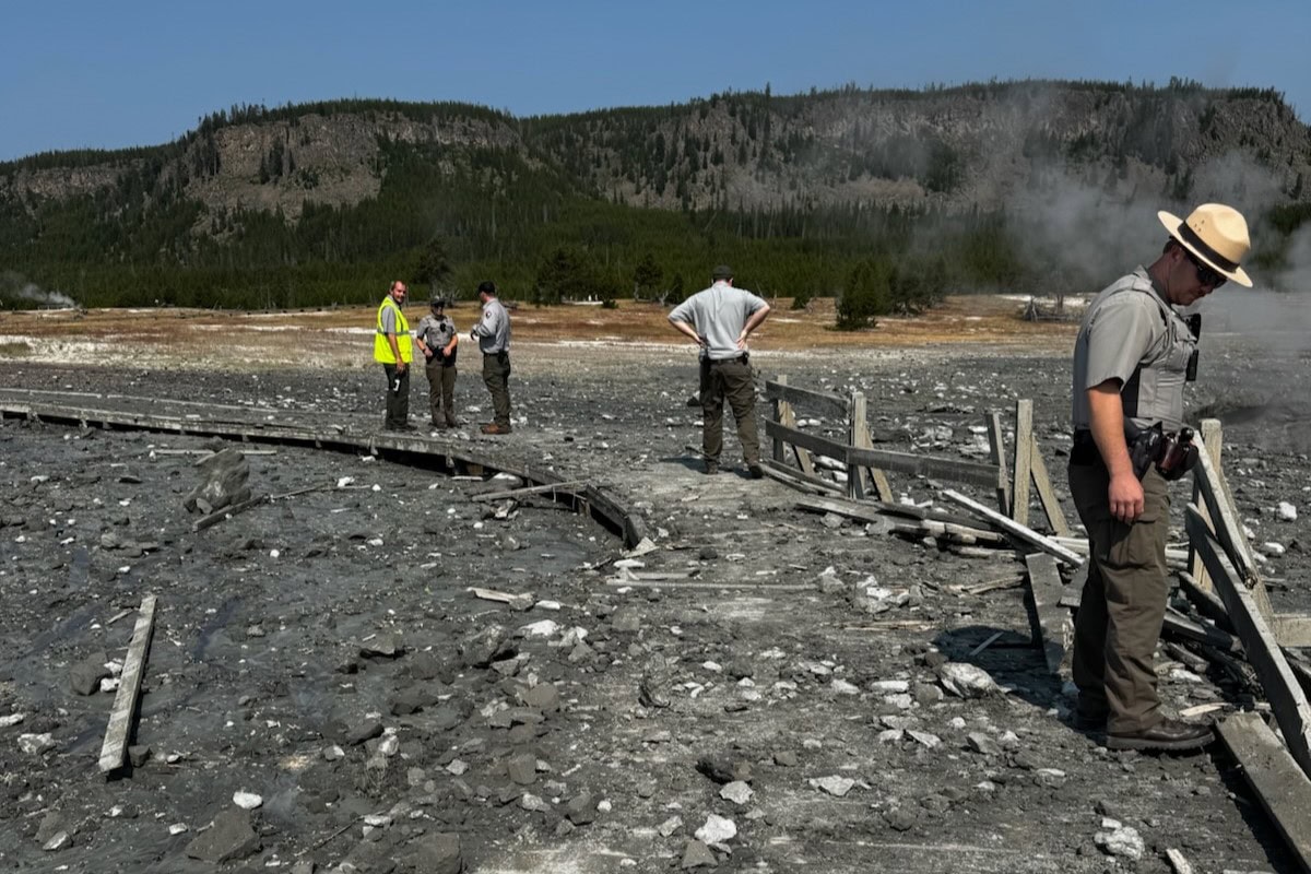 Staff assess damage on the boardwalk after hydrothermal explosion at Biscuit Basin in Yellowstone National Park - Image credit: NPS